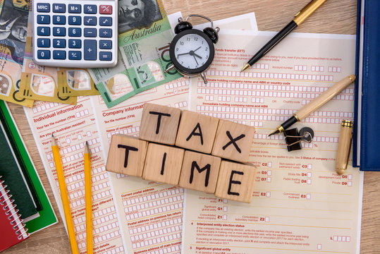 Australian 'tax time', tax form with money on table