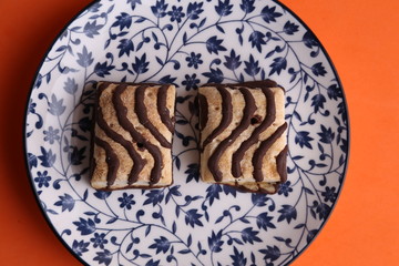small chocolate cakes in color background