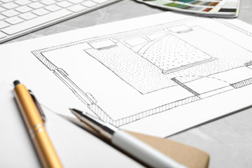 Bedroom plan on light grey marble table, closeup. Designer's workplace
