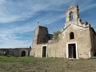 Fototapeta na wymiar empty buildings of abandoned fortress Juromenga in portugal