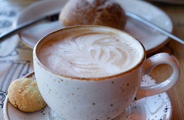 Ready-to-drink cappuccino with foam in a white Cup.