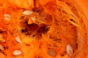 Pumpkin in half. close-up. Half Pumpkin Seed, Raw Food. Vegetarian food. Abstract texture