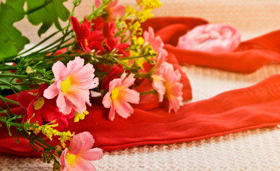 Heart with a red ribbon. Heart close up. Greeting card Happy Valentine's Day. Flowers with a heart