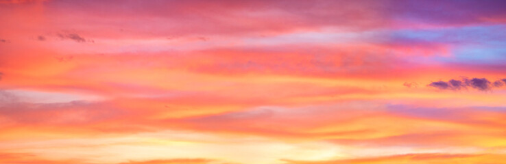 Panorama of colorful x clouds in the sunset sky