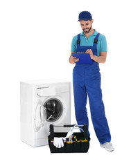 Repairman with clipboard and toolbox near washing machine on white background