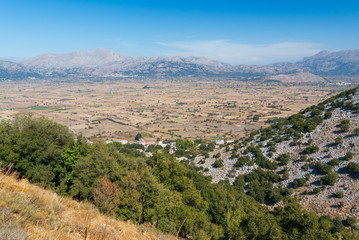 Fototapeta na wymiar View on the towns of Plati and Magoulas on the Lasithi Plateau, Crete, Greece