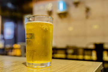 Close up shot of glass of cold beer
