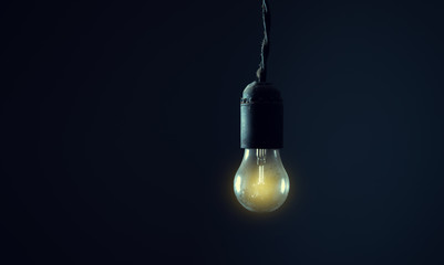 light bulb on the dark room background.