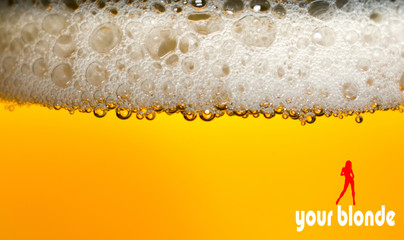 fresh blonde beer poured into a crystal glass. Beer makes a lot of foam. Image with beer in a...