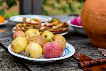 Traditional cossacks' meal with soused apples and lardo appetizers