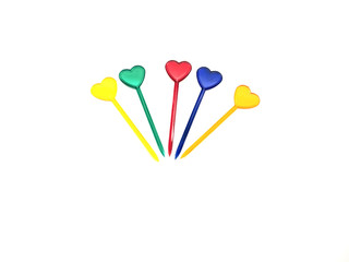 Skewers isolated on a white background. A composition of skewers for food. Skewers in the form of a heart. Food and Valentine's Day.