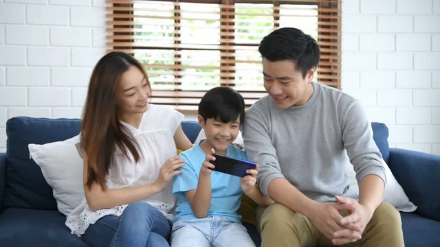 Family concept. Parents are encouraging their children to play fun games. 4k Resolution.