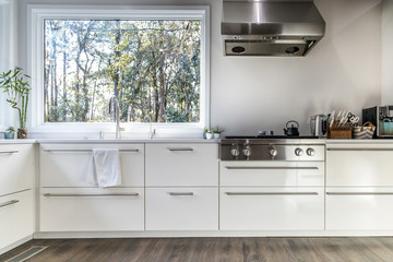 spacious large modern white kitchen recently updated with high end appliannces, wood floors,...