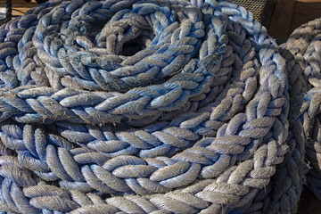 Blue plaits of vessel cordage.