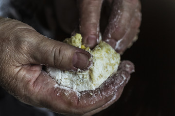 mother's hands unroll dough for pies. Pies with eggs and onions. Cooking pies.