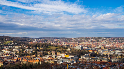 Germany, Aerial view above stuttgart downtown houses, skyscraper and skyline with sun and clouds