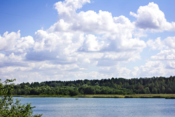 beautiful landscape - river, forest, sky in the clouds