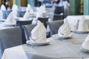 Tables set for meal in modern restaurant