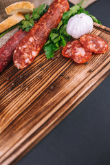 Italian salami with herbs, garlic and baguette slices
