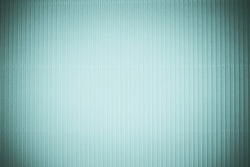 Fototapeta premium Corrugated blue color paper background texture, copy space, template. Colorful background, corrugated paper cardboard, copy space, template.