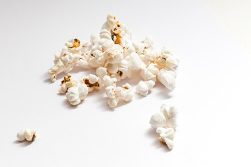 Pile of delicious popcorn isolated on white background.