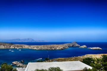 summer landscape of the Greek island of Rhodes with blue cloudless sky and sea