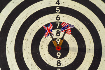 Two darts in center of target. USA and UK hit the target.