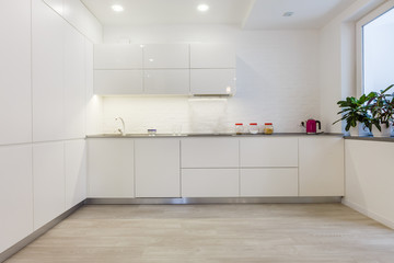 Modern white kitchen without handles