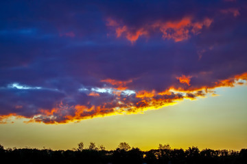 the expressive contrast of the clouds in the sky
