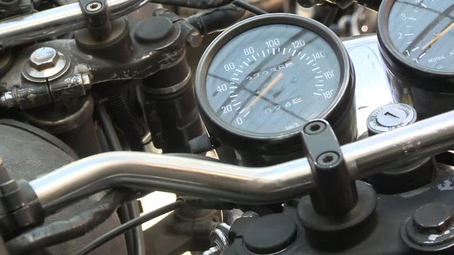 CU PAN Close-up of motorcycle speedometer