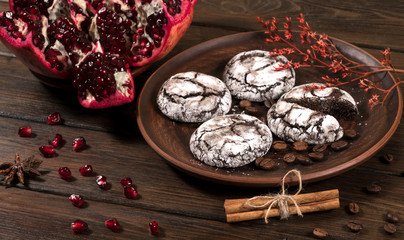 top view of chocolate chip cookies,  and pomegranate on wooden table background