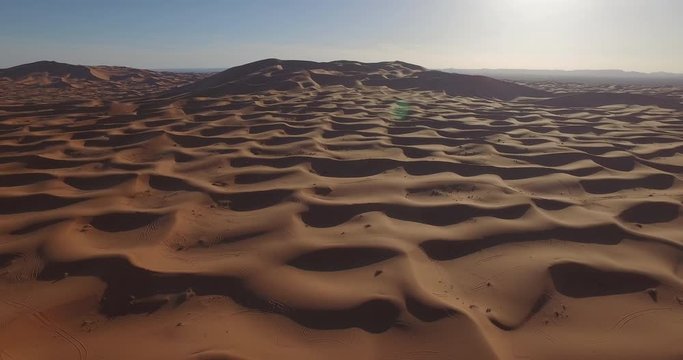 Panning shot of rippled sand dunes, Erg Chebbi, Morocco