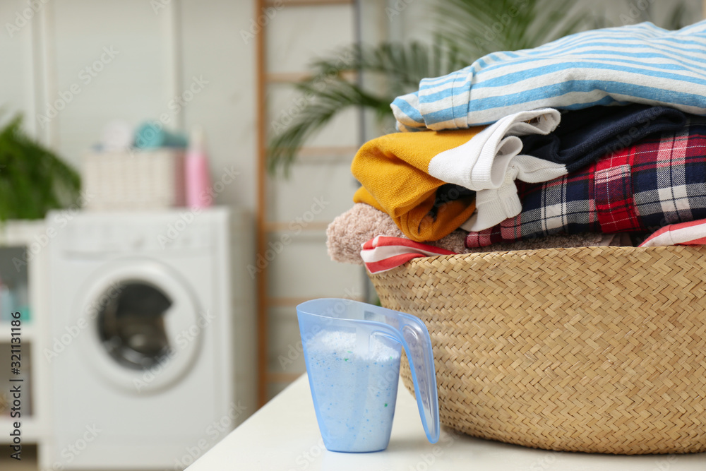 Canvas Prints wicker basket with laundry and detergent on countertop in bathroom. space for text