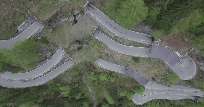 Aerial view of car passing through tunnels on winding road, Spluegen Pass, Italy