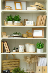 White shelving unit with different decorative elements