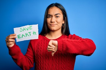 Young beautiful asian woman holding paper asking for save earth and enviroment conservation with...