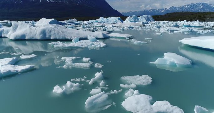 Drone footage of icebergs and glaciers in water, Alaska, USA