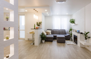 Interior design with couch, colorful cushions and lamp