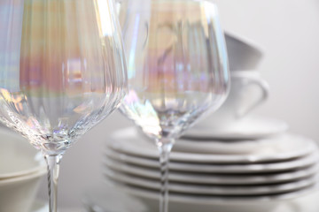 Set of glasses and dishes on table, closeup