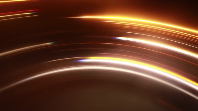 Abstract Spinning Light Trails Against Black Background