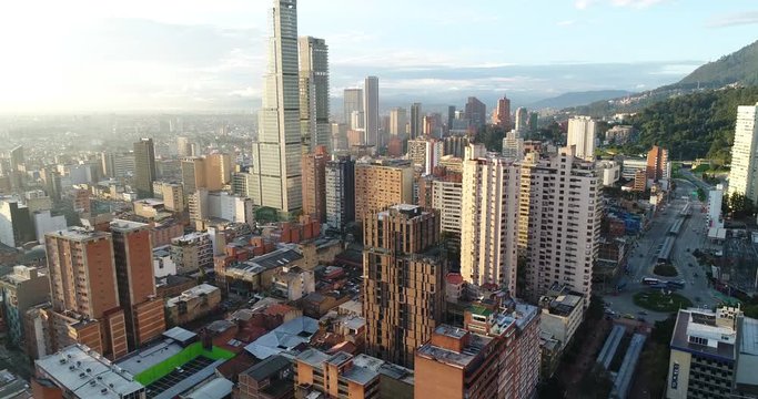 Aerial footage of buildings and towers in city on sunny day, Bogota, Colombia