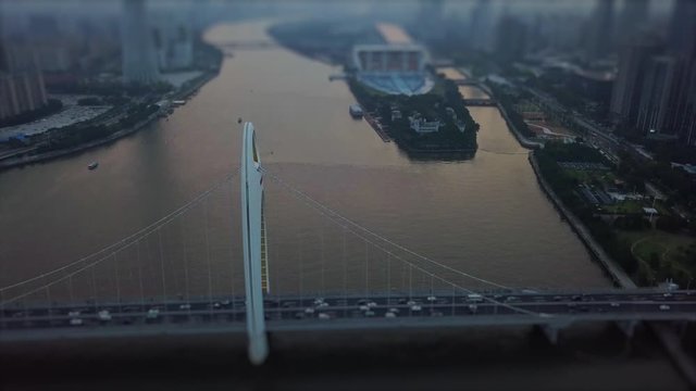 sunset sky guangzhou city pearl river liede bridge haixinsha island aerial panorama tilt-shift 4k china