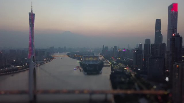 sunset guangzhou city downtown canton tower liede bridge river aerial panorama tilt-shift 4k china