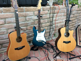 guitars of different kinds on display waiting to be played