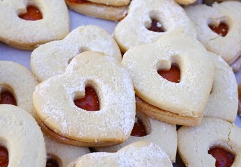 A heart shaped sugar sandwich cookie with berry jam for Valentine's Day