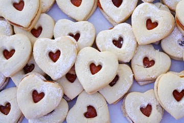 A heart shaped sugar sandwich cookie with berry jam for Valentine's Day