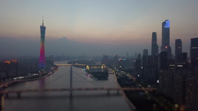 night illuminated guangzhou downtown canton tower river bridge aerial panorama tilt-shift 4k china