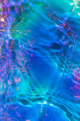 Multicolored iridescent water ripple conceptual photo