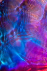 Iridescent ripples in water