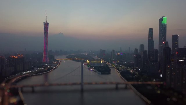 night illuminated guangzhou downtown canton tower river bridge aerial panorama tilt-shift 4k china